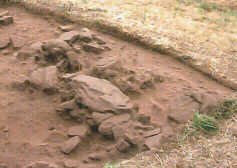 The foundations of the possible outhouse or privy, adapted from what may have been a Bronze Age cist burial.